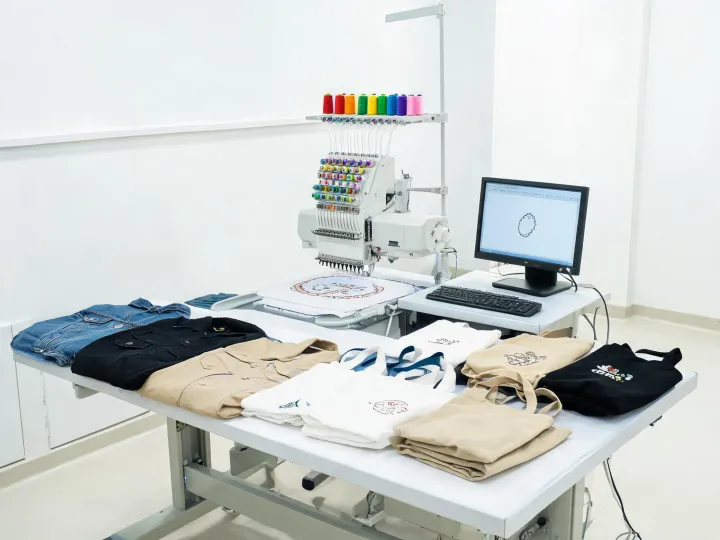 On-demand embroidery station with mixed finished garments